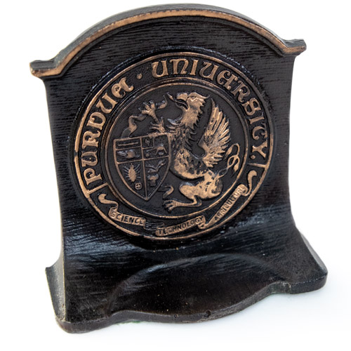 Purdue seal on a black bookend