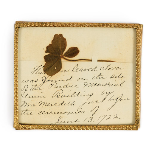 four leaf clover on a piece of paper with writing