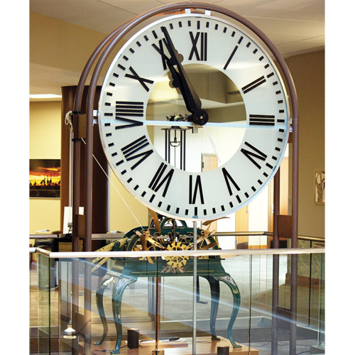 big clock surrounded by glass gate