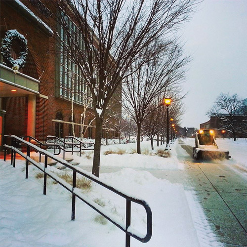 Snow on ground around a building