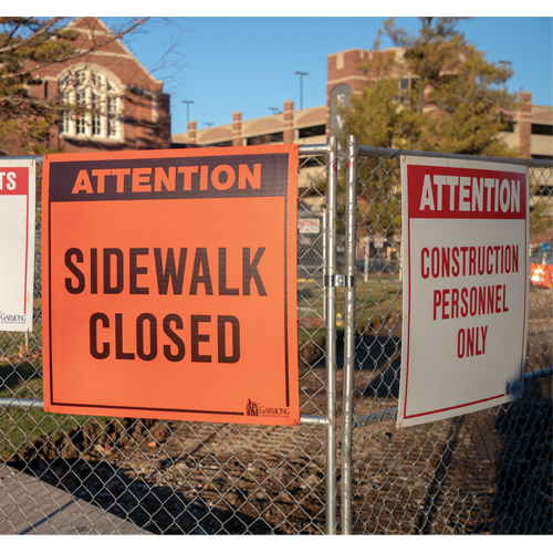 Sign with the words sidewalk closed