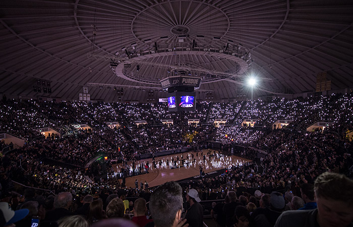 a dimly lit mackey arena during the pregame show