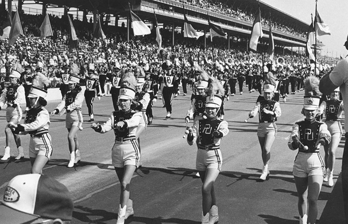 archive photo of the purdue marching band performing on the Indianapolis motor speedway