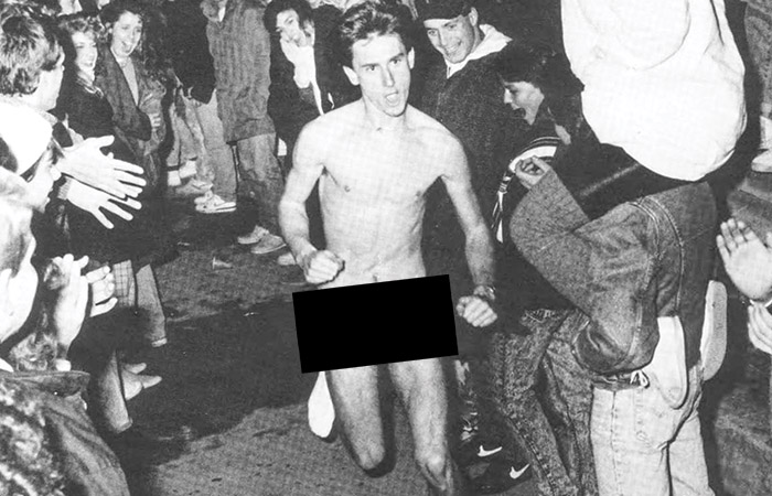 a naked male running in his socks