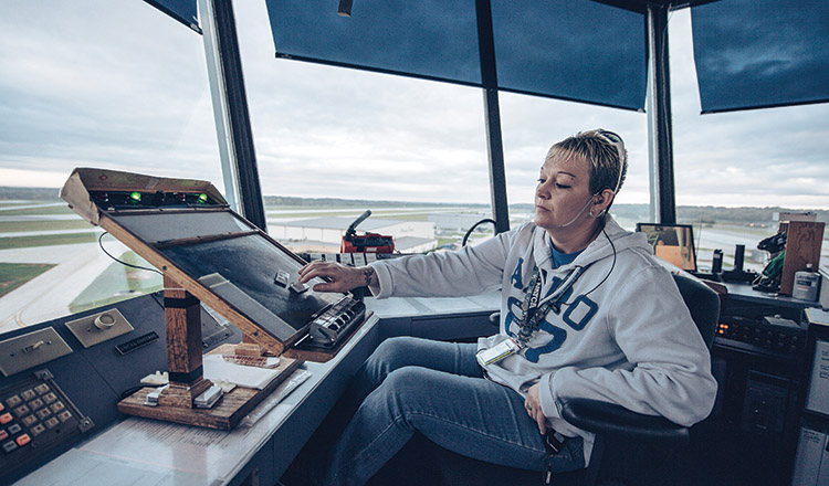 An air traffic controller monitors the aircraft
