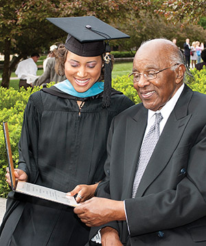 Dr. Cornell Bell and Krannert graduate Khrystyne Heard at the 2005 graduation2005 Spring graduation