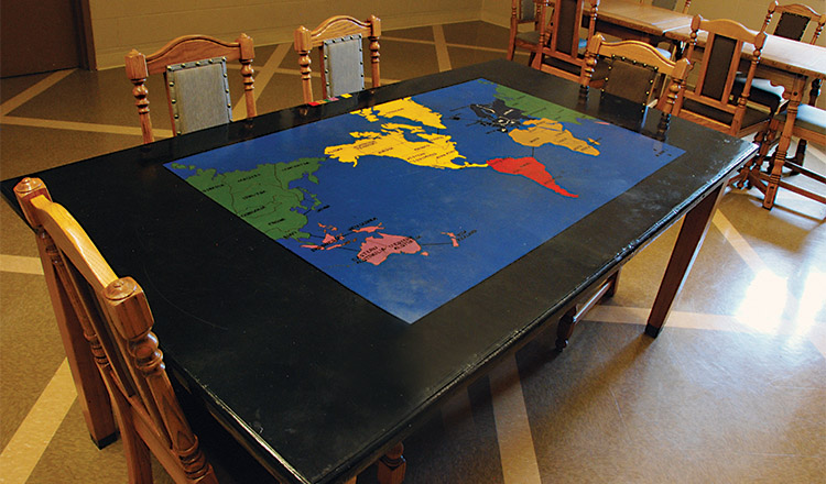 A table with the Risk board painted on top