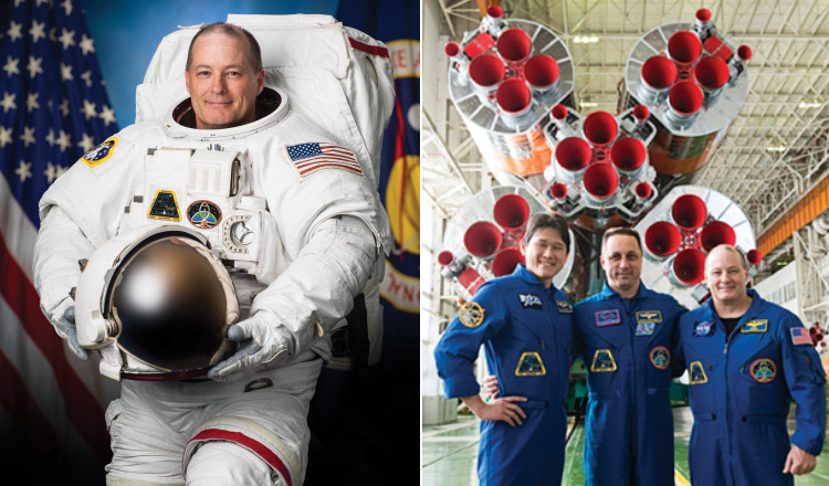 Tingle and his fellow crewmembers pose in front of the engines of a Soyuz booster