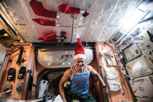 Tingle wearing a Santa hat on the ISS