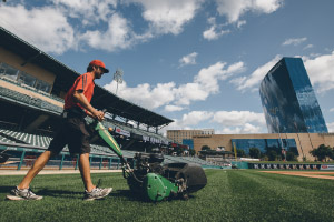 Joey Stevenson mows the grass at Victory Field.