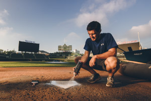 Ben Baumer paints home plate at Wrigley Field.