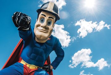 Purdue Pete in a superman costume