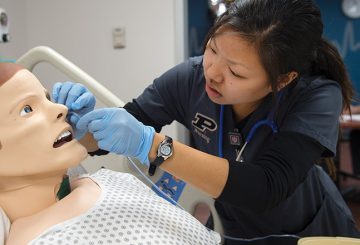 a student nurse works on a dummy