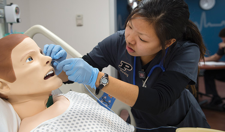 a student nurse works on a dummy