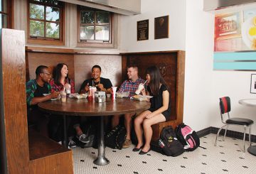 a group of students sitting in the corner booth at Pappy's