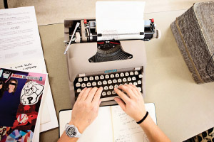 hands typing on a typewrite