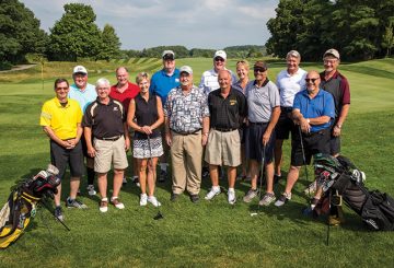 The reunion group posing at the golf course