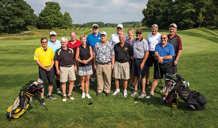 The reunion group posing at the golf course