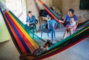 a dults and students in hammocks